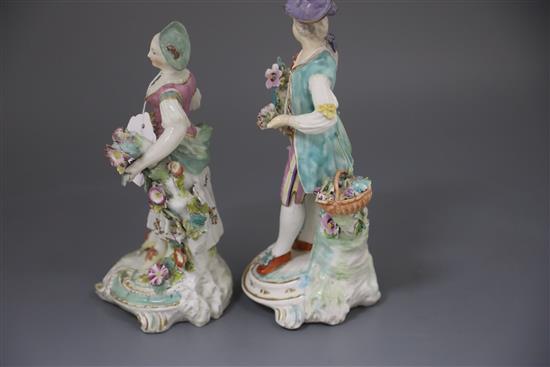 A pair of large Derby figures of flower sellers, c.1760, H. 26.5 and 24.5cm